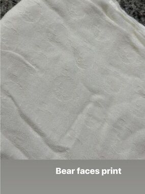 Tula White Baby Blanket with Embossed Bear Face Pattern
